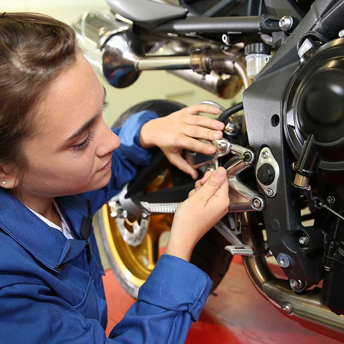 Young person working on a engine